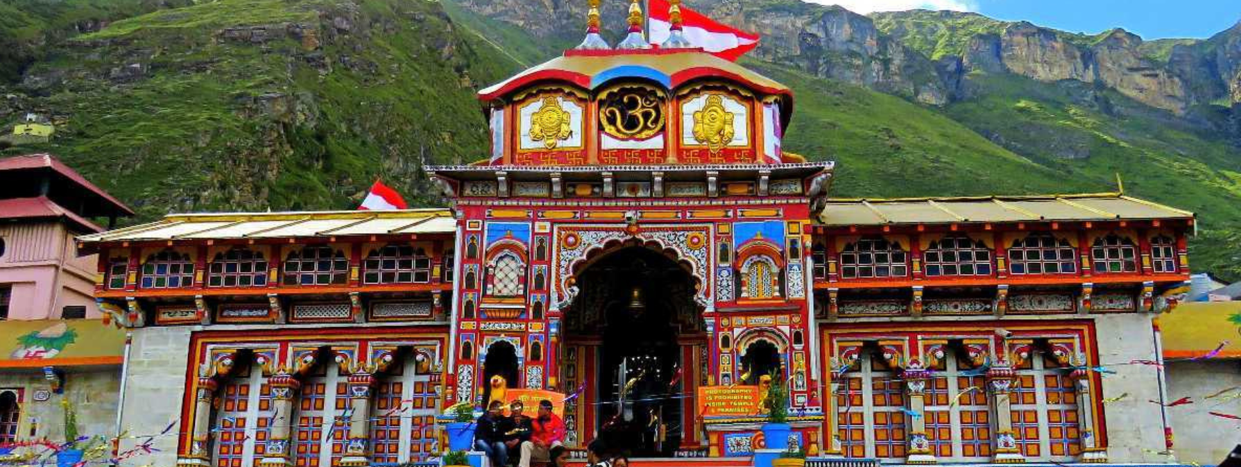 Badrinath Temple — wide panoramic view with the Himalayan peaks and Alaknanda river valley
